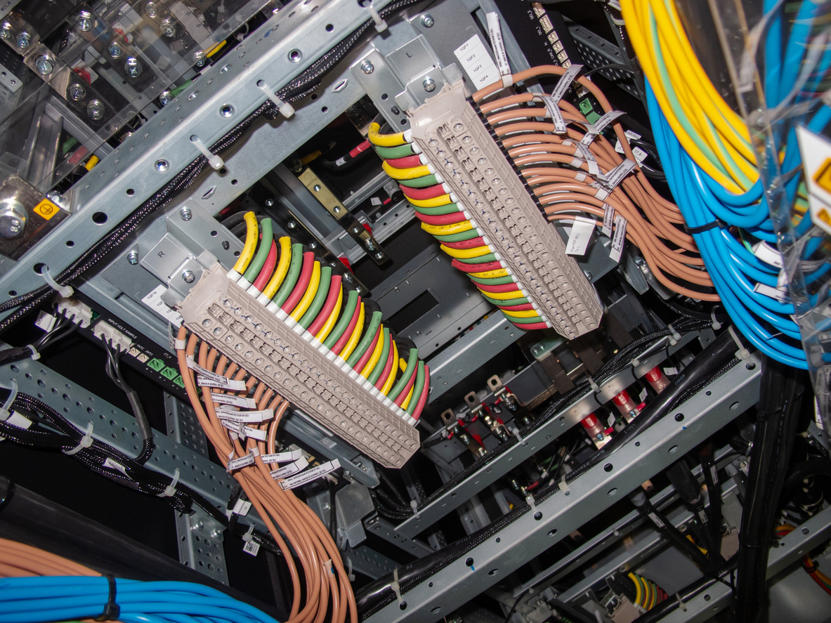 Detailed view of network cabling setup in a data center, showcasing wires and connectors meticulously organized for optimal performance and connectivity management. For article on UL standards and specifications